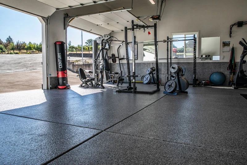 Flake-coated garage floor set up as a home gym